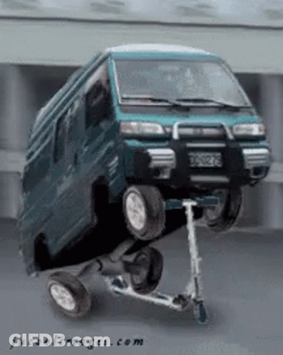 A Van Is Sitting On Top Of A Scooter With Jucoolimages.com Written On The Bottom GIF