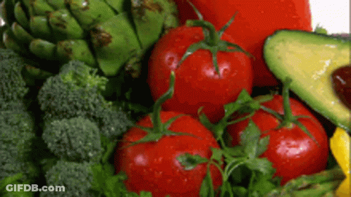 A Variety Of Fresh Vegetables Including Broccoli Tomatoes Avocado And Artichokes GIF
