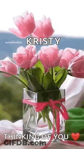 A Vase Filled With Pink Flowers With The Name Kristy On It . GIF
