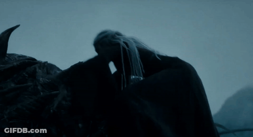 A Very Large Dragon With A Very Long Neck And Sharp Teeth GIF