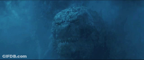 A Very Large Monster Is Swimming In The Water And Looking At The Camera GIF