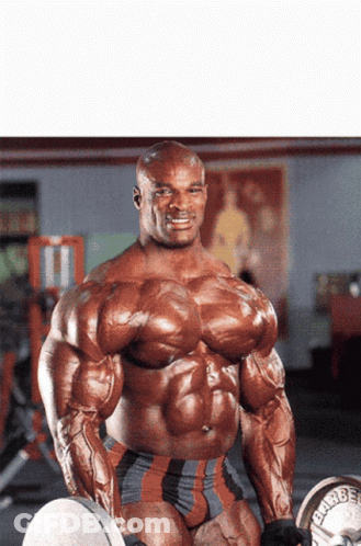 A Very Muscular Man Is Holding A Barbell That Says ' Hammer ' On It GIF