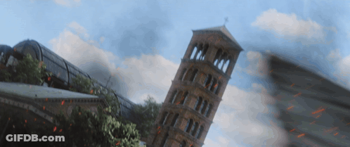 A Very Tall Building Is Being Destroyed By Fire GIF