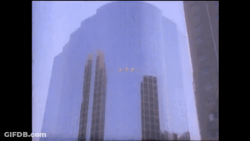 A Very Tall Building With The Letters I.t.p. Visible GIF