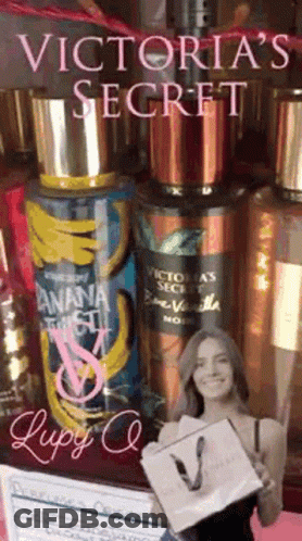 A Victoria 'S Secret Advertisement With A Woman Holding A Shopping Bag GIF