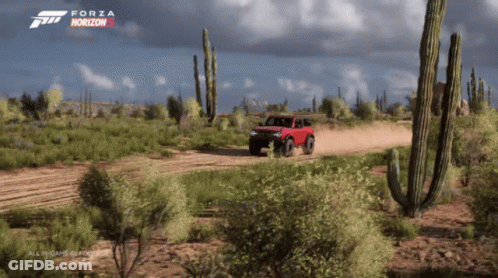 A Video Game Called Forza Horizon 5 Shows A Red Truck Driving Through A Desert GIF