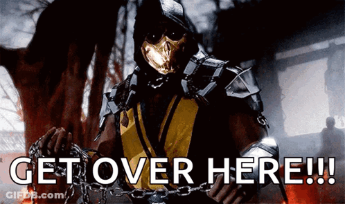 A Video Game Character Is Chained To A Wall And Says Get Over Here GIF
