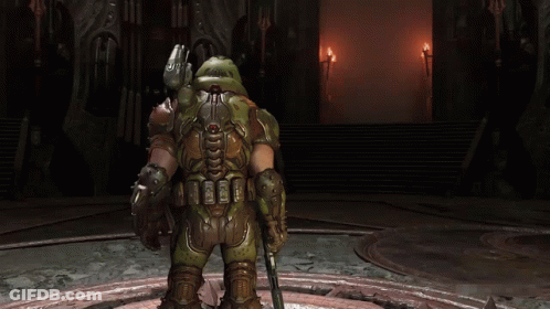 A Video Game Character Is Holding A Gun And Giving A Thumbs Up . GIF