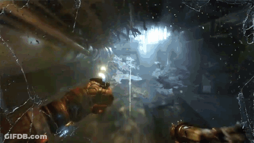 A Video Game Character Is Holding A Gun Behind A Broken Glass GIF