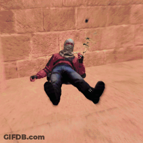 A Video Game Character Is Laying On The Floor In A Green Room GIF