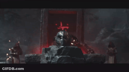 A Video Game Character Is Sitting On A Throne With A Helmet That Says ' Doom ' On It GIF