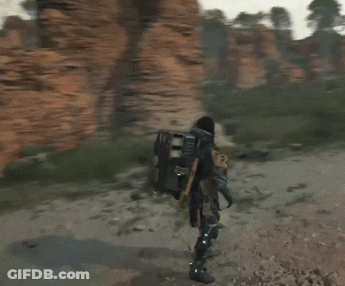 A Video Game Character Is Standing In Front Of A Person GIF