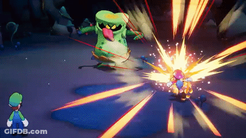 A Video Game Character , Luigi , Is Fighting A Monster In A Dark Cave . GIF