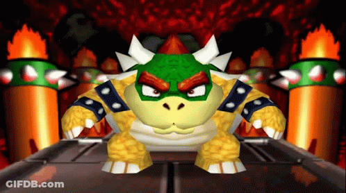 A Video Game Character Named Bowser Is Standing In Front Of A Fire GIF