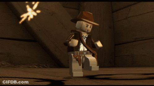 A Video Game Character Says " You Idiot " In Orange Text GIF
