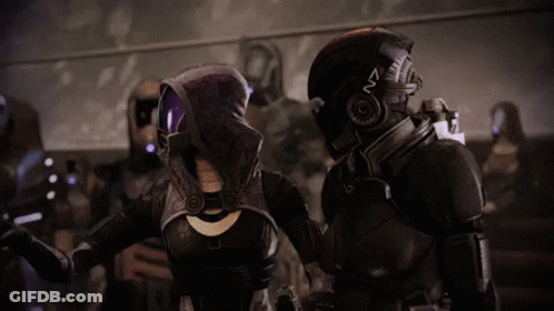 A Video Game Character With A Helmet That Says N7 GIF
