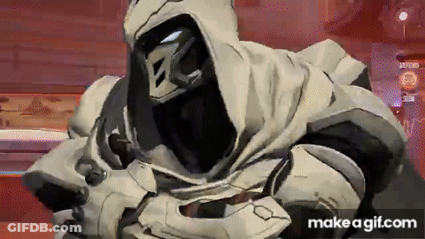 A Video Game Character With A Hood On His Head Is Standing In A Room With A Red Background . GIF