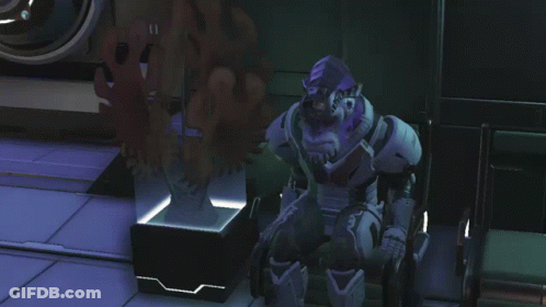 A Video Game Character With A Purple Head And A Beard Is Standing In A Room GIF