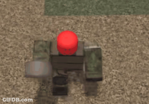 A Video Game Character With A Red Helmet Is Sitting On The Ground GIF