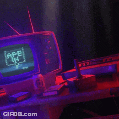 A Video Game Controller Is Sitting On A Table Next To A Television GIF