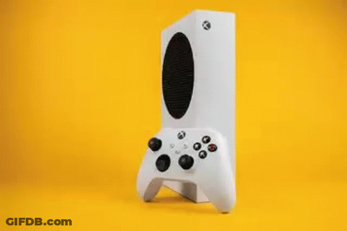 A Video Game Controller Is Sitting On A Table Next To A Video Game Box . GIF