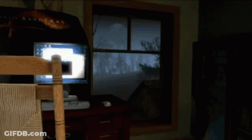 A Video Game Is Being Played In A Room With A Sign That Says Roots On It GIF