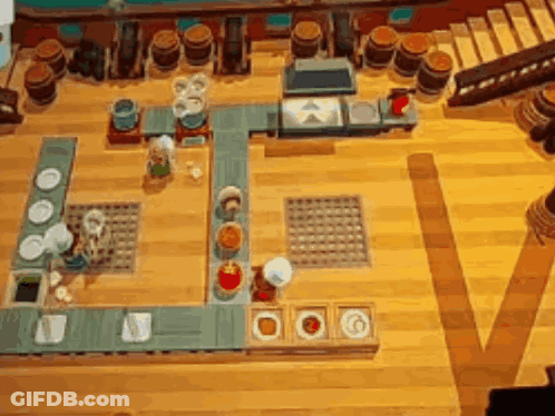 A Video Game Is Being Played On A Wooden Table GIF