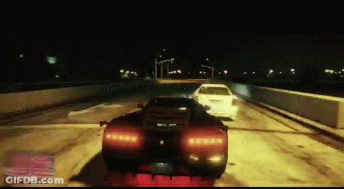 A Video Game Screen Shows A Car Driving Down The Road At Night GIF