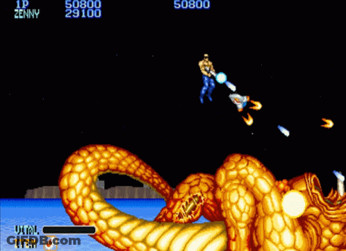 A Video Game Screen Shows A Man Fighting A Golden Dragon And Says Zenny GIF