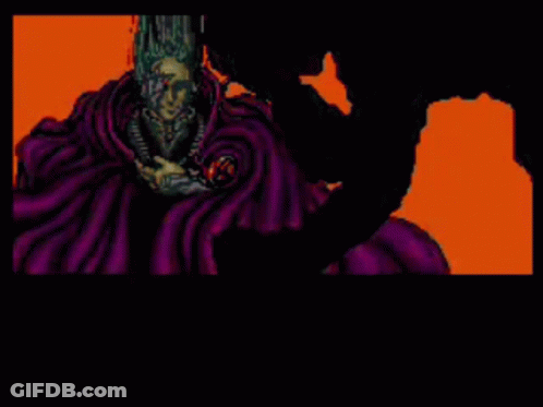 A Video Game Screen Shows A Man Sitting In Front Of A Red Screen That Says " Cats " GIF