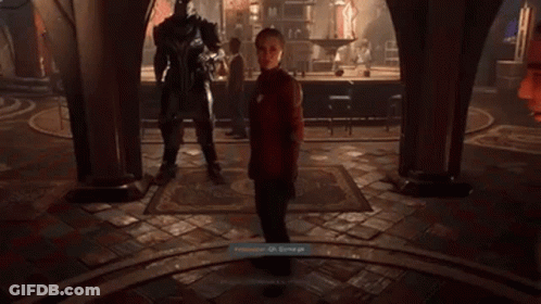 A Video Game Screen Shows A Man Standing Next To A Giant Robot GIF