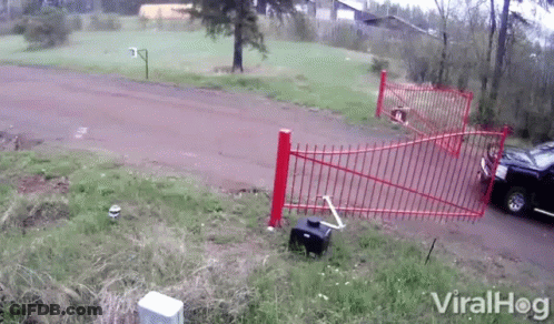 A Video Of A Car Crashing Into A Red Fence With Viralhog Written On The Bottom Right GIF