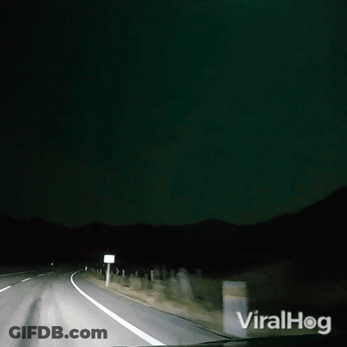 A Video Of A Car Driving Down A Road With The Words Viralhog On The Bottom Right GIF