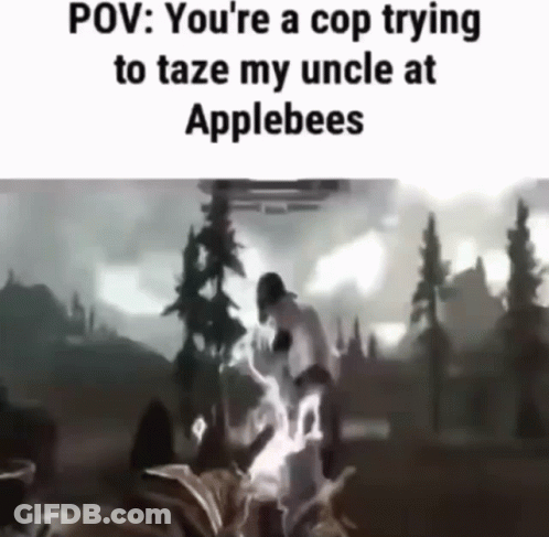A Video Of A Cop Trying To Taze An Uncle At Applebees . GIF