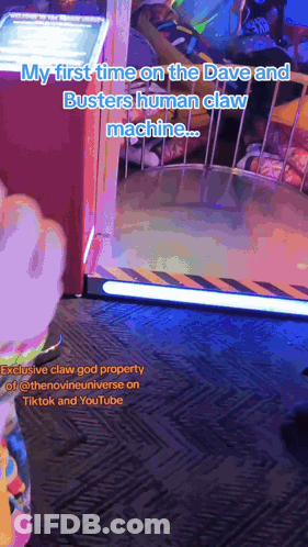 A Video Of A Person Playing A Game Called Busters Human Claw Machine GIF
