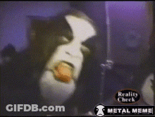 A Video Of A Person With A Tongue Sticking Out And The Words Reality Check Metal Meme GIF