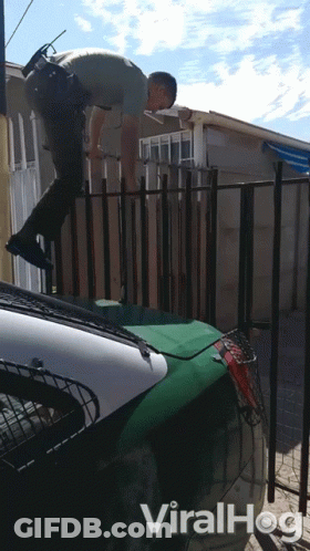 A Video Of A Police Officer Jumping Over A Fence Has The Word Viralhog On The Bottom GIF