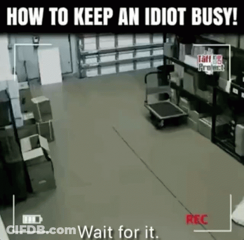 A Video Of A Warehouse With The Words " How To Keep An Idiot Busy " At The Top GIF