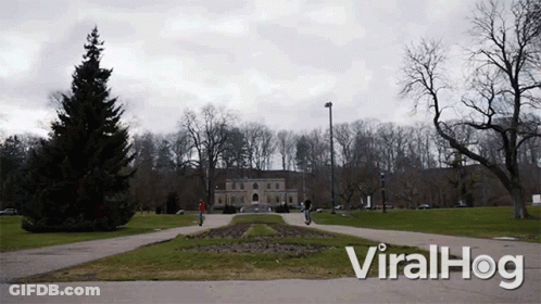 A Video Of People Riding Scooters In A Park With The Words Viralhog At The Bottom GIF