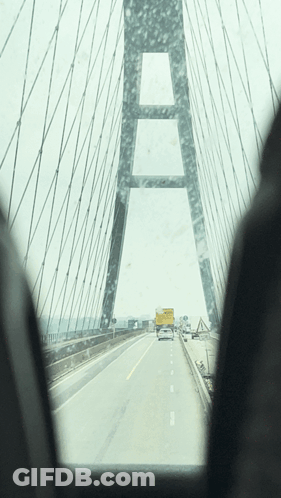 A View Of A Bridge From A Car Window GIF