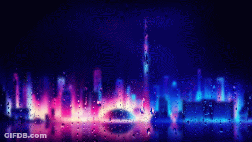 A View Of A City Skyline Through A Window With Rain Drops On It GIF
