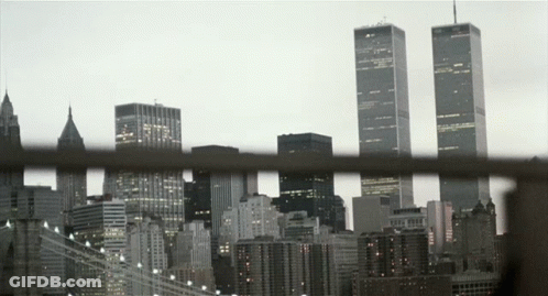A View Of A City Skyline With The Twin Towers In The Distance GIF