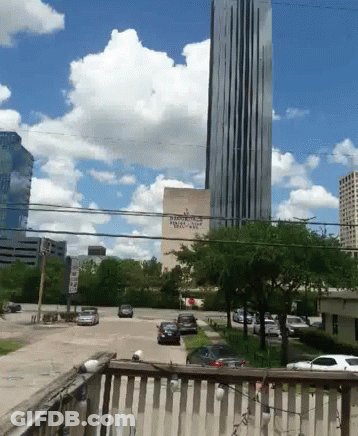 A View Of A City With A Building That Says ' Bank Of America ' On It GIF