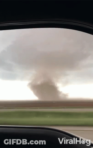 A View Of A Tornado From Inside A Car With The Words Viralhog On The Bottom GIF