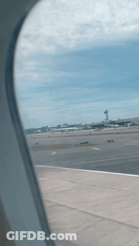 A View Of An Airport Runway From An Airplane GIF