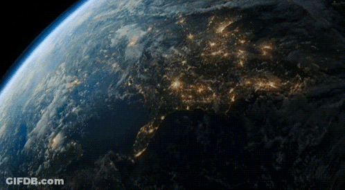 A View Of The Earth From Space At Night With A Lot Of Lights Visible GIF