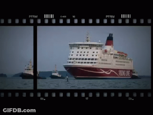 A Viking Line Cruise Ship Is Being Towed By A Tugboat GIF