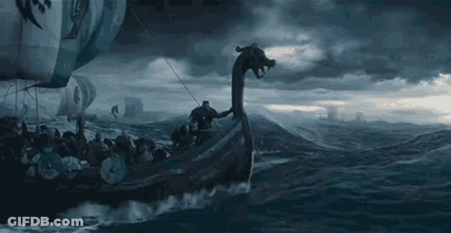 A Viking Ship With A Dragon Head Is Floating On Top Of A Body Of Water . GIF
