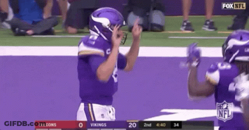 A Vikings Football Player Is Giving The Middle Finger During A Football Game . GIF