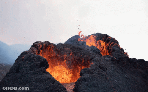 A Volcano Is Erupting With A Lot Of Flames GIF
